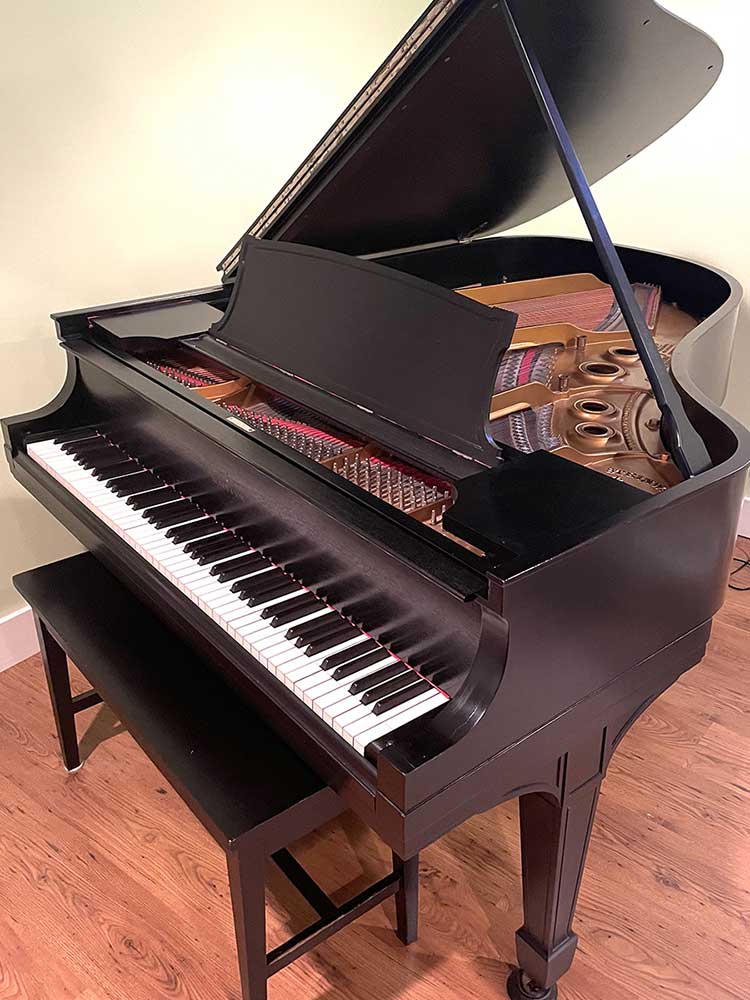 complete view of a steinway model M grand piano for sale